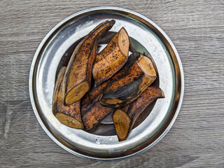 boiled bananas on a tin plate