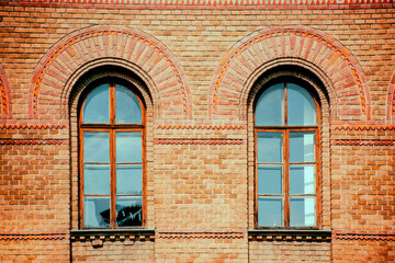 windows in the brick wall of an old building, ancient architecture. High quality photo