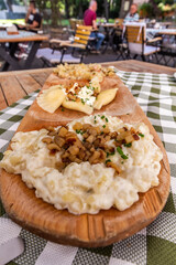 Plate of traditional Slovak dishes - kapustove strapacky (dumplings with cabbage), bryndzove pirohy...