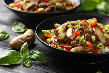 Stir fry Crispy Orange Beef with sweet peppers, onion and rice. Asian food