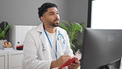 African american man doctor having medical consultation at clinic