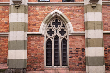 gothic church windows in orange bricks 