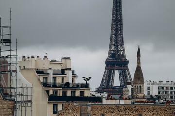View of the Parisian rooftops and the Eiffel Tower from the 16th arrondissement of Paris - obrazy, fototapety, plakaty
