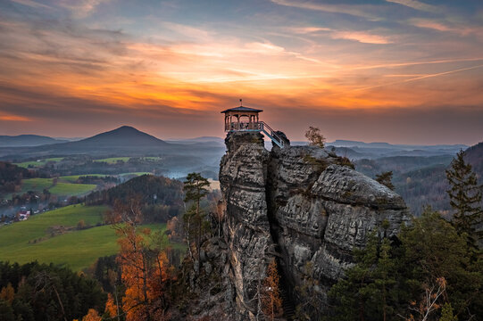 Jetrichovice, Czech Republic - Aerial view of Mariina Vyhlidka (Mary's view) lookout with a beautiful Czech autumn landscape and colorful golden sunset sky in Bohemian Switzerland region