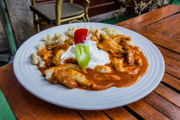 Authentic Hungarian dish - Perkelt with Galuska dumplings