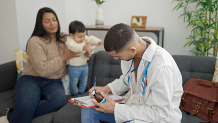 Couple and son prescribing medication at clinic