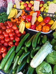 Close-up fresh organic vegetables and fruits on shelf in farmers market or local bazaar. Healthy food market concept. Vitamins and minerals. Dieting concept. Agricultural hobby, business and industry