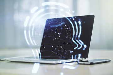 Creative artificial Intelligence concept with human head hologram on modern laptop background....