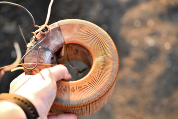 Copper coil. Copper wire wound on a coil. Copper scrap.