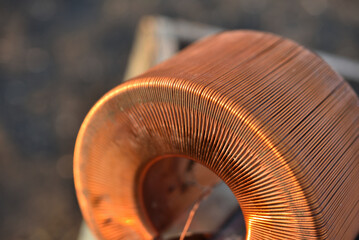 Copper coil. Copper wire wound on a coil. Copper scrap.