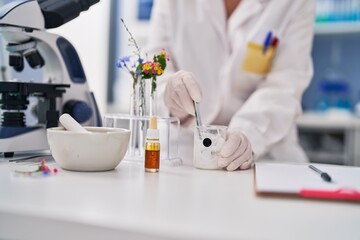 Fototapeta premium Middle age woman scientist working at laboratory