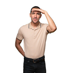 Fototapeta premium Concentrated young man with a gesture of looking far