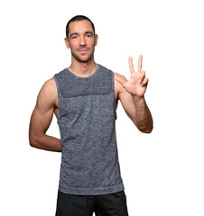 Naklejka premium Young man making a number three gesture