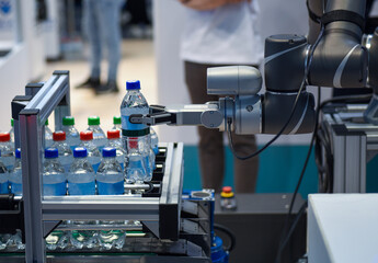 Robotic arm serving water bottles