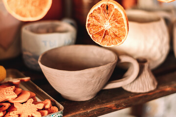 Ceramist's workshop.Close-up of shelves with clay pottery.Small business,entrepreneurship,hobby, handmade concept.