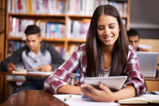 University, tablet and woman in library happy for online research, studying and learning. Education, academy and female student on digital technology for knowledge, internet and website course
