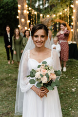 The bride is ready to throw her bridal bouquet. wedding tradition with the bride. bride at sunset...