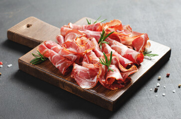 Cured Meat Platter, Coppa with Spices, Italian Antipasto, Appetizer over Dark Background