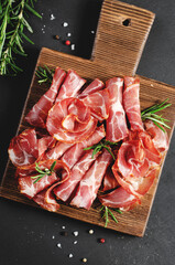 Cured Meat Platter, Coppa with Spices, Italian Antipasto, Appetizer over Dark Background