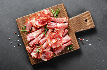 Cured Meat Platter, Coppa with Spices, Italian Antipasto, Appetizer over Dark Background