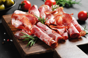 Cured Meat Platter, Coppa with Spices, Italian Antipasto, Appetizer over Dark Background