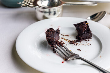 Chocolate cake with a fork on a plate