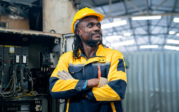 African man working at factory - Powered by Adobe
