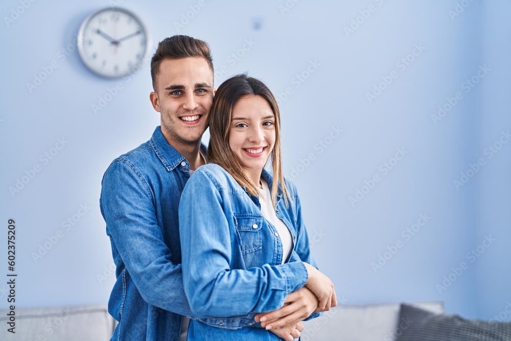 Sticker Man and woman couple hugging each other standing at home