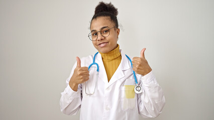 Young african american woman doctor doing thumbs up over isolated white background