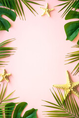 Fototapeta na wymiar Summer flat lay on pink background. Tropical leaves, palm leaves and sea shells.