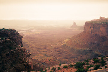 Orange Cliffs Overlook at canyonlands during rainfall and sunset - obrazy, fototapety, plakaty