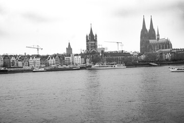 Fototapeta premium Cologne, Germany. Famous Hohenzollern Bridge over Rhine river. Buildings in historic city centre