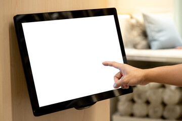 Using interactive touchscreen display in home decoration store. Male customer hand touching on LCD touch screen monitor on the wall for browsing information in furniture design shop.