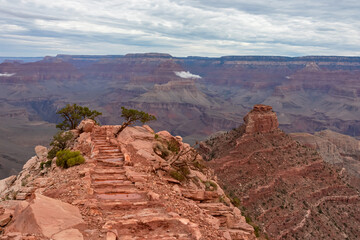 Panoramic aerial view from Ooh Ahh point on South Kaibab hiking trail at South Rim of Grand Canyon National Park, Arizona, USA. Colorado River weaving through valleys and rugged terrain. O Neill Butte