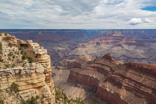 Massive rock formation with panoramic view of O Neill Butte seen from South Kaibab hiking trail at South Rim of Grand Canyon National Park, Arizona, USA. Colorado River weaving through rugged terrain © Chris