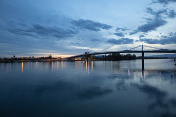 Obraz premium Sunset view of 'Lo Passador' bridge (Deltebre, Sant Jaume d'Enveja), Catalonia, Spain