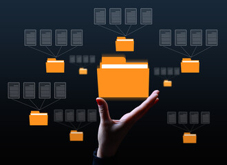A female hand and virtual icons of folders and files, a concept of data organization and archiving,...