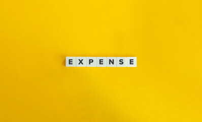 Expense (Outflow of Money). Letter Tiles on Yellow Background. Minimal Aesthetics.