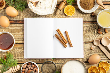 Fototapeta na wymiar Frame of Ingredients for cooking Christmas baking and gingerbread cookies on a wooden background, top view. New Year, holidays, copy space