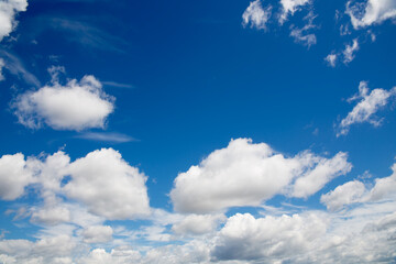 Deep blue skies with white clouds background
