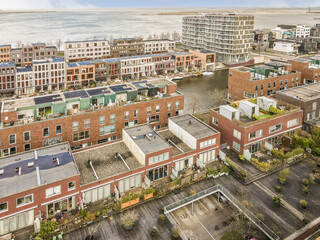 Obraz premium an aerial view of a city with buildings and the ocean in the background, taken from a bird's - eye view