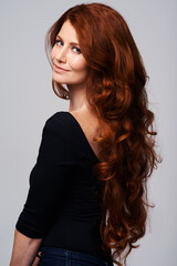 Red head, hair care and portrait of woman for wellness, keratin treatment and haircare on white background. Beauty salon, hairdresser and ginger female model with shine, healthy and natural hairstyle