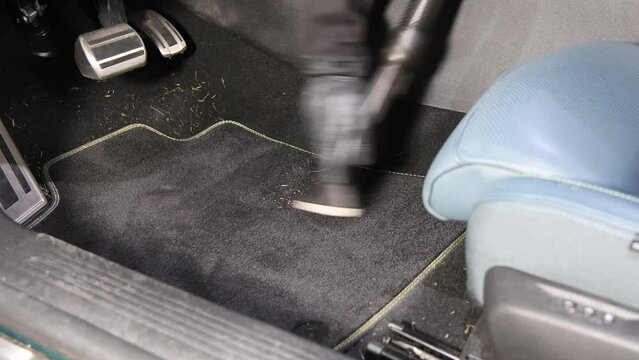 footwell car detailing with a vaccum cleaner
