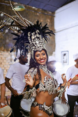 Dance, portrait and exotic woman dancer performing with a band at mardi gras or cultural festival....