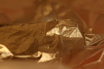 Soft focus blur Abstract Gold crumpled texture paper copy space background.