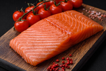 Fresh raw salmon red fish fillet with salt and spices