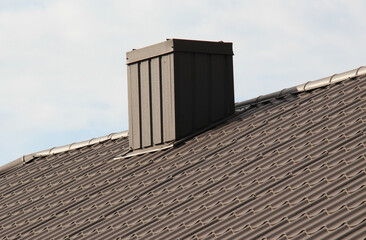 Chimney on the roof of the house.