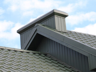 Chimney on the roof of the house.