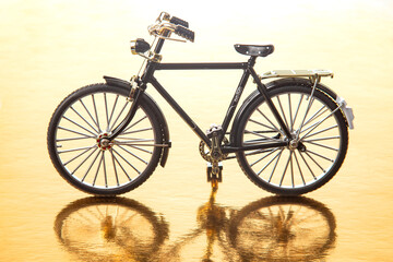 Fototapeta na wymiar road bike model on a yellow background. transport for travel