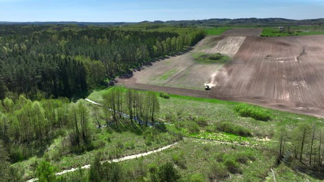 A drone view of the landscape of Warmia in the spring during field work, northern Poland, Europe